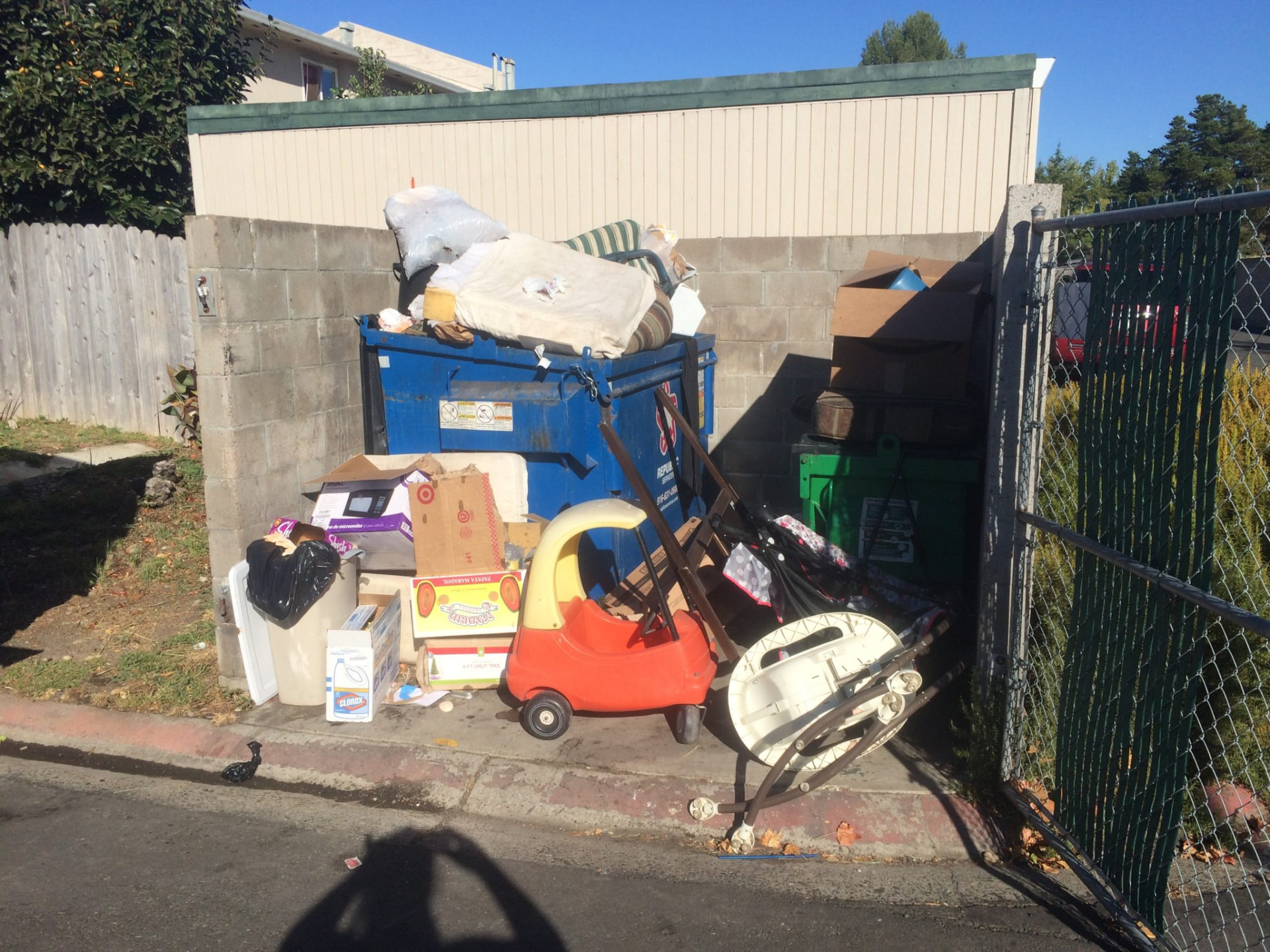 Junk piled in one spot at the curb where the trailer can back right up to it